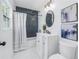 Modern bathroom featuring a shower and tub, stylish tile, a sleek vanity, and decor at 4541 2Nd N Ave, St Petersburg, FL 33713