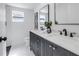 Modern bathroom featuring a double vanity with marble countertops and sleek fixtures at 4541 2Nd N Ave, St Petersburg, FL 33713