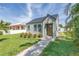 Charming single-Gathering home featuring a lush green lawn and inviting walkway at 4541 2Nd N Ave, St Petersburg, FL 33713