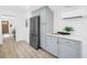 Kitchen with stainless steel appliances, light countertops and a view to the living room at 4541 2Nd N Ave, St Petersburg, FL 33713