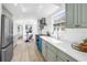 Light kitchen featuring modern appliances, ample countertop space, and a view into the dining area at 4541 2Nd N Ave, St Petersburg, FL 33713