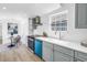 Bright kitchen with stainless steel appliances, light countertops and a view into the dining area at 4541 2Nd N Ave, St Petersburg, FL 33713