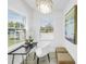 Bright office featuring a modern desk, chair, natural light, and stylish chandelier at 4541 2Nd N Ave, St Petersburg, FL 33713