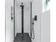 Walk-in shower with black and white tile, and modern fixtures at 4541 2Nd N Ave, St Petersburg, FL 33713