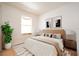 Cozy bedroom with neutral tones and ample natural light, creating a serene atmosphere at 5511 N 32Nd St, Tampa, FL 33610
