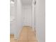 Hallway view showcasing the neutral color palette and tile flooring throughout at 5511 N 32Nd St, Tampa, FL 33610
