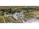 Aerial view of townhome complex showing rooftop patios, community landscaping, and nearby residences at 6207 64Th N Way, Pinellas Park, FL 33781