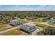 Aerial view of contemporary townhomes showcasing modern design elements and lush landscaping with neighborhood views at 6207 64Th N Way, Pinellas Park, FL 33781