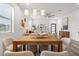 Contemporary dining room with modern lighting, neutral decor, and an inviting seating area beyond at 6207 64Th N Way, Pinellas Park, FL 33781
