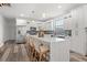 Modern kitchen with quartz counters, island seating, stainless steel appliances, and blue backsplash at 6207 64Th N Way, Pinellas Park, FL 33781