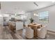 Modern kitchen and dining area featuring a large island and stainless steel appliances at 6207 64Th N Way, Pinellas Park, FL 33781