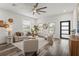 Bright living room with modern furniture, stylish decor, wood flooring, and natural lighting at 6207 64Th N Way, Pinellas Park, FL 33781
