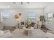 Bright living room with modern furniture, stylish decor, wood flooring, and large windows at 6207 64Th N Way, Pinellas Park, FL 33781