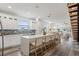 Bright living space with stainless steel appliances, subway tile backsplash, island with seating, and dining area at 6207 64Th N Way, Pinellas Park, FL 33781