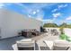 Rooftop patio featuring outdoor lounge furniture, dining area, and sun loungers with sky view at 6207 64Th N Way, Pinellas Park, FL 33781