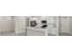 Bright kitchen featuring white cabinets, stainless steel appliances, and a modern island with a sink at 6224 Timberdale Ave, Wesley Chapel, FL 33545