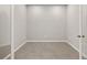 An empty room features neutral paint, trim, and stone flooring at 6224 Timberdale Ave, Wesley Chapel, FL 33545