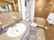 This bathroom features tile floors, tile walls, single vanity, and tub with shower at 6718 Ranchwood Loop, New Port Richey, FL 34653