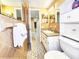 Charming bathroom featuring classic tile, a bright vanity, and a comfortable layout at 6718 Ranchwood Loop, New Port Richey, FL 34653