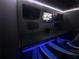 Relaxation room featuring mounted televisions and unique blue accent lights at 6718 Ranchwood Loop, New Port Richey, FL 34653
