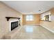 Comfortable living area with fireplace, open to the kitchen with plenty of natural light at 6718 Ranchwood Loop, New Port Richey, FL 34653