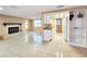 Open-concept living space with fireplace, and kitchen with bar seating and modern amenities at 6718 Ranchwood Loop, New Port Richey, FL 34653