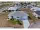 An aerial view showing the home with a front facing garage, landscaping, and driveway at 702 W Brockton Pl # 2, Sun City Center, FL 33573