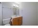Traditional-style bathroom has a light wood vanity, toilet, and neutral wall color at 702 W Brockton Pl # 2, Sun City Center, FL 33573