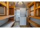 Indoor laundry room with shelves and a stackable washer and dryer at 702 W Brockton Pl # 2, Sun City Center, FL 33573