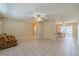 Bright, open living area with tile floors and views of dining area at 702 W Brockton Pl # 2, Sun City Center, FL 33573