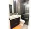 Modern bathroom featuring a sleek vanity, toilet, and glass-enclosed shower at 8208 Pinewood Run Ct, Tampa, FL 33647