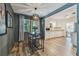 Dining area features a modern table set, unique light fixture, and open view to kitchen at 1013 E North St, Tampa, FL 33604