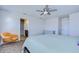 The bedroom includes a ceiling fan, ensuite bathroom, and neutral-colored carpet at 11117 Abaco Island Ave, Riverview, FL 33579