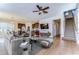 Inviting open-concept living space with a modern design, seamlessly connecting the living area, dining space, and kitchen at 11117 Abaco Island Ave, Riverview, FL 33579