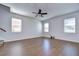 Bright living area with hardwood floors and ample natural light with staircase access, enhancing the open feel at 11117 Abaco Island Ave, Riverview, FL 33579
