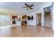 Bright and airy open-concept living room with hardwood floors and easy access to the kitchen and upstairs at 11117 Abaco Island Ave, Riverview, FL 33579