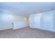Neutral carpeted loft area with access to rooms and railing overlooking the lower level at 11117 Abaco Island Ave, Riverview, FL 33579