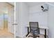 This interior office has carpet flooring, a door to the bathroom, and a white wire rack at 11117 Abaco Island Ave, Riverview, FL 33579
