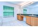 Bright bathroom featuring double vanity, large mirror, and large window providing natural light at 18126 Kara Ct, Tampa, FL 33647