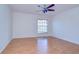 Clean bedroom with wood floors, a ceiling fan, and a bright window at 18126 Kara Ct, Tampa, FL 33647