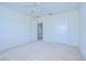 Clean bedroom featuring carpet, a ceiling fan, and a closet at 18126 Kara Ct, Tampa, FL 33647