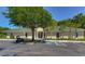 Clubhouse exterior with golf cart parking, front entrance, landscaping, and easy accessibility at 18126 Kara Ct, Tampa, FL 33647