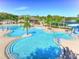 Aerial view of a resort-style community pool with slides and ample lounging space at 18126 Kara Ct, Tampa, FL 33647
