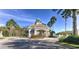 Gated community entrance with lush landscaping and a secure entry point at 18126 Kara Ct, Tampa, FL 33647