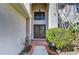 Elegant home entrance with decorative glass doors and a transom window at 18126 Kara Ct, Tampa, FL 33647