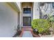 Elegant home entrance with decorative glass doors and a transom window at 18126 Kara Ct, Tampa, FL 33647