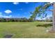 Scenic view of the lush golf course with beautiful trees and blue sky at 18126 Kara Ct, Tampa, FL 33647