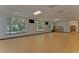 Bright hall featuring large windows with natural light and a sleek laminate floor at 18126 Kara Ct, Tampa, FL 33647