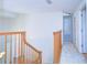 Upstairs hallway showcases neutral carpeting and trim with access to rooms, creating a bright transition space at 18126 Kara Ct, Tampa, FL 33647