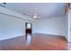 Spacious living room with hardwood floors, fan, and sliding glass doors at 18126 Kara Ct, Tampa, FL 33647